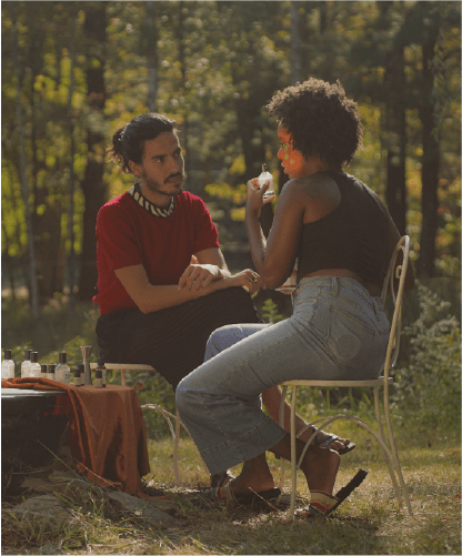 a perfumer leading an aromatic ceremony in the woods